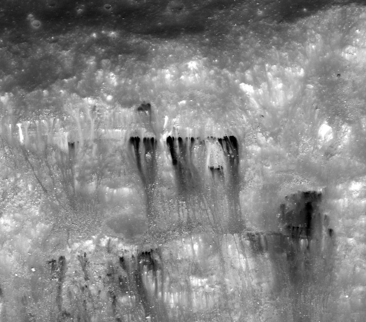 Dark streaks in Diophantus crater